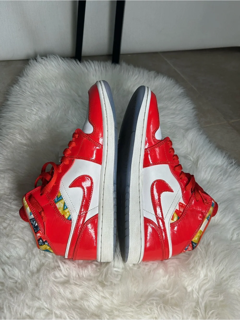 Jordan High-Top Sneakers in Red with Multicolor Heel Pattern